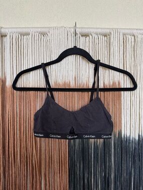 Black Calvin Klein bralette with small cut out and adjustable straps